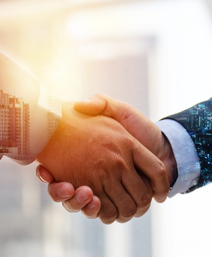 Investor. double exposure image of investor business man handshake with partner for successful meeting deal with during sunrise and cityscape background, investment, partnership, teamwork concept